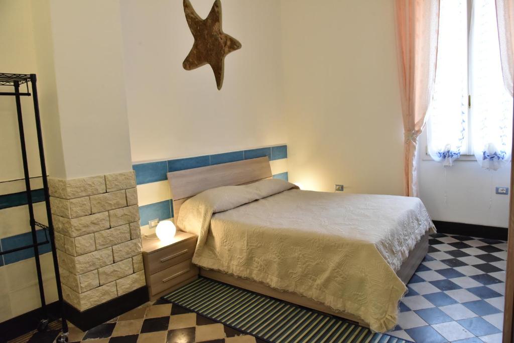 Postel nebo postele na pokoji v ubytování Casa Isabella Light Blue Intero Appartamento