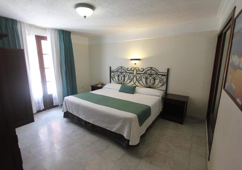 Postel nebo postele na pokoji v ubytování Hotel Francis Drake