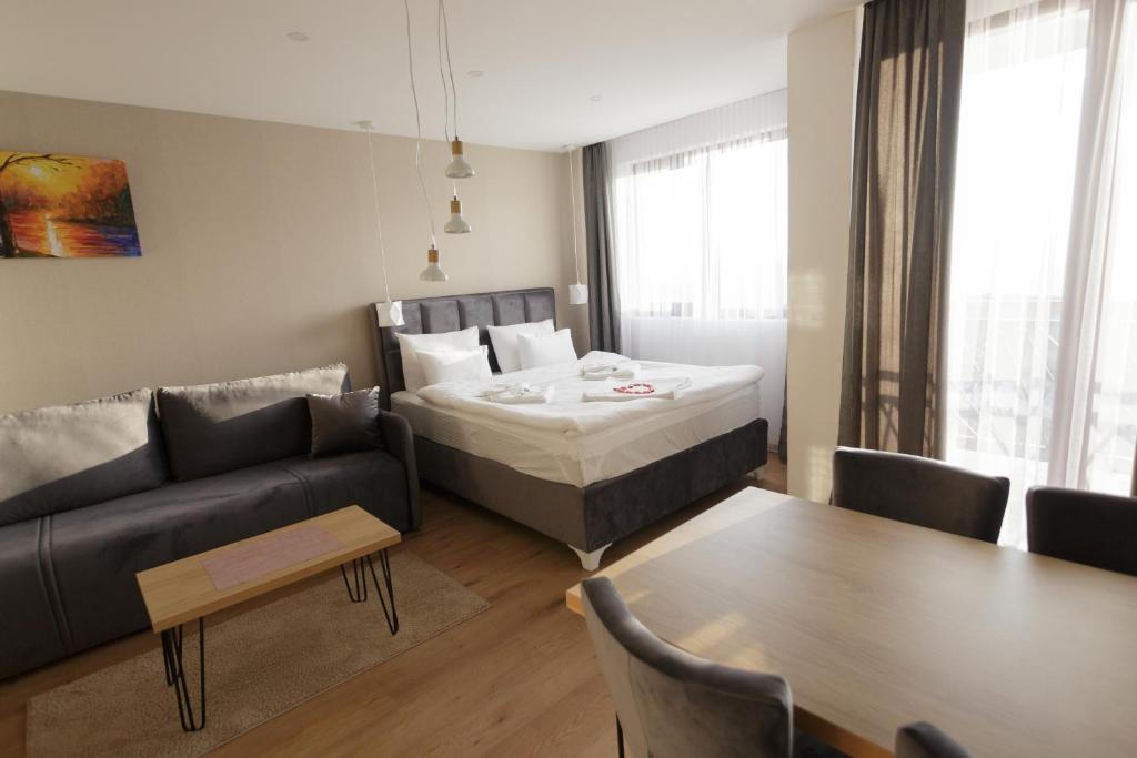 Postel nebo postele na pokoji v ubytování Harmonija Resort - Harmonija Kopaonik