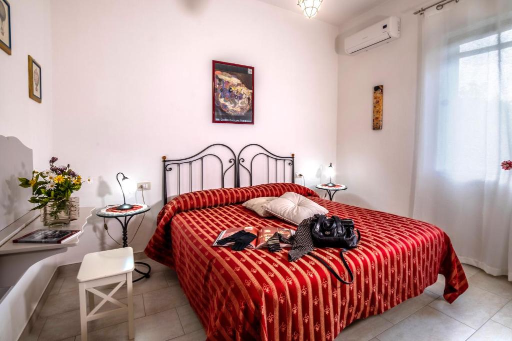 Postel nebo postele na pokoji v ubytování Torremerlata B&B