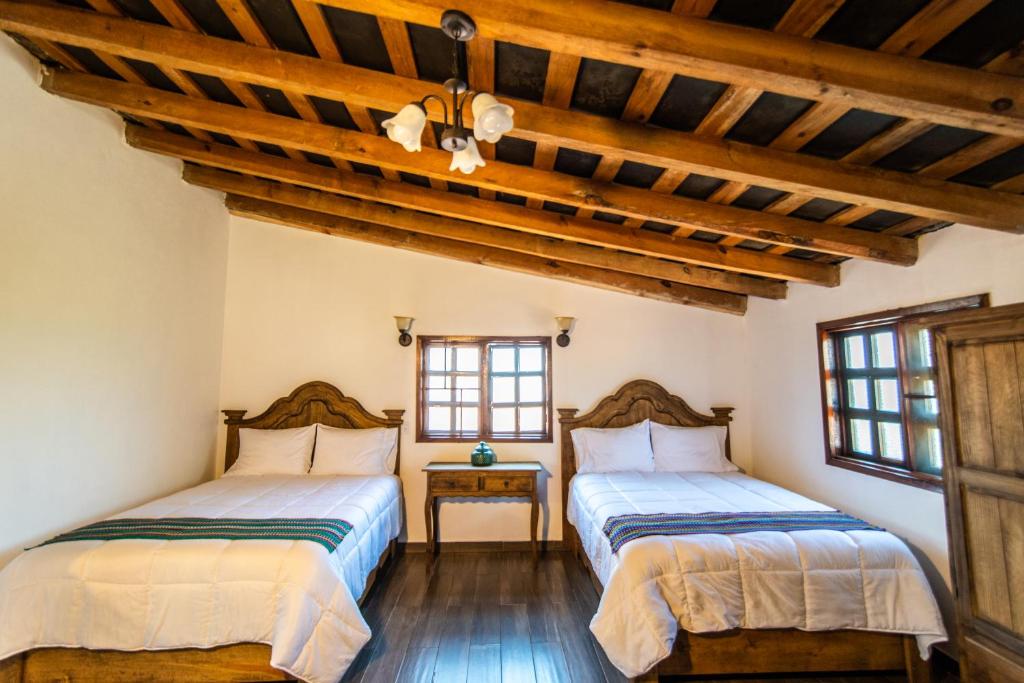 En eller flere senge i et værelse på La Diligencia Cabañas Campestres