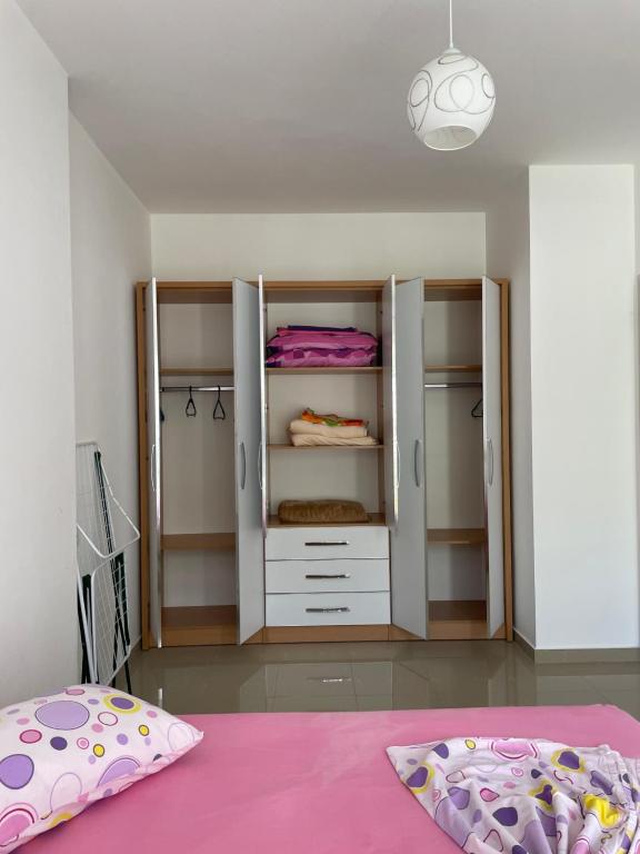 Postel nebo postele na pokoji v ubytování Nimfeum Apartments
