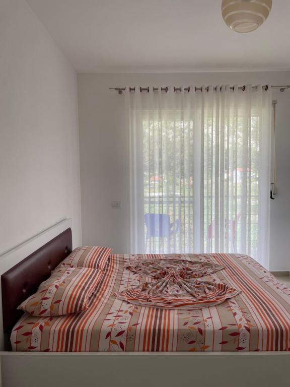 Postel nebo postele na pokoji v ubytování Nimfeum Apartments