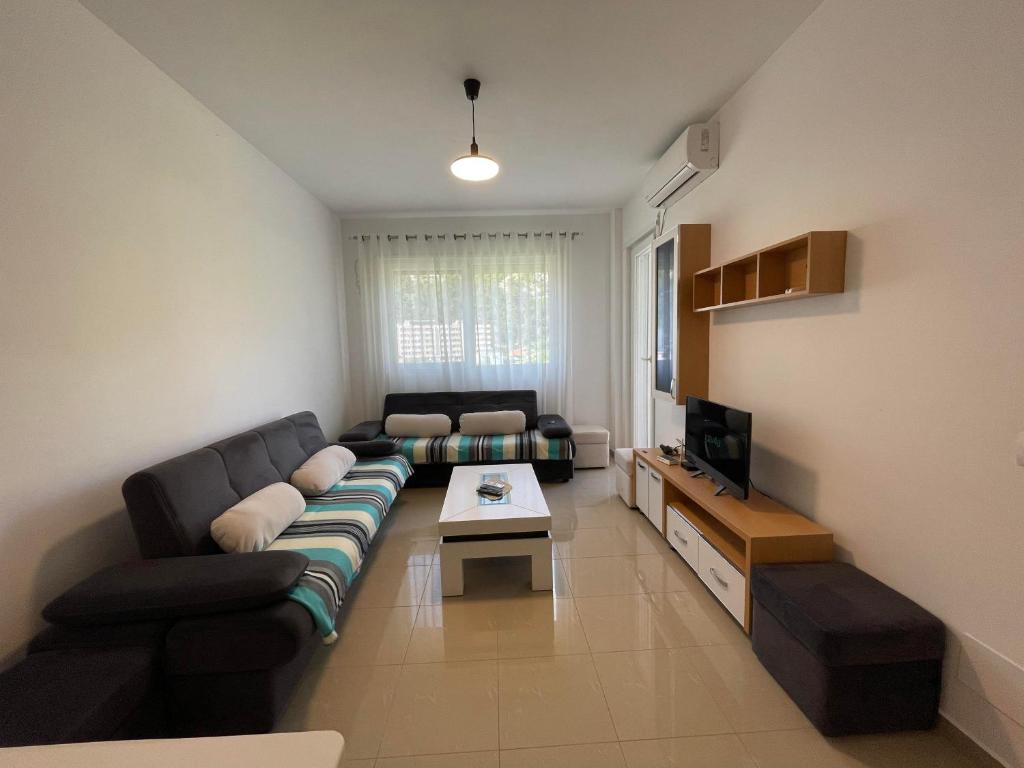 TV a/nebo společenská místnost v ubytování Nimfeum Apartments
