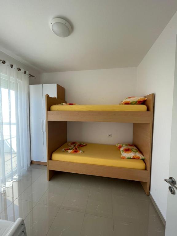 Postel nebo postele na pokoji v ubytování Nimfeum Apartments