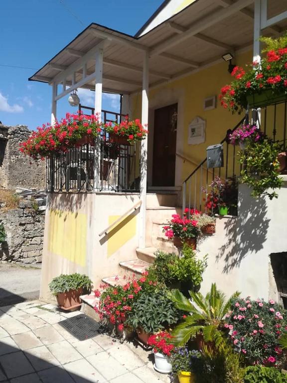 a house with flower boxes on the front of it at Casa D'arte in Tocco da Casauria