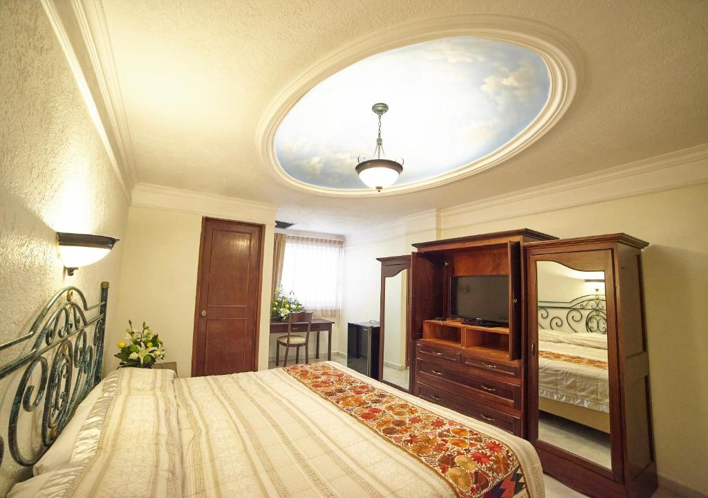 Postel nebo postele na pokoji v ubytování Hotel Francis Drake