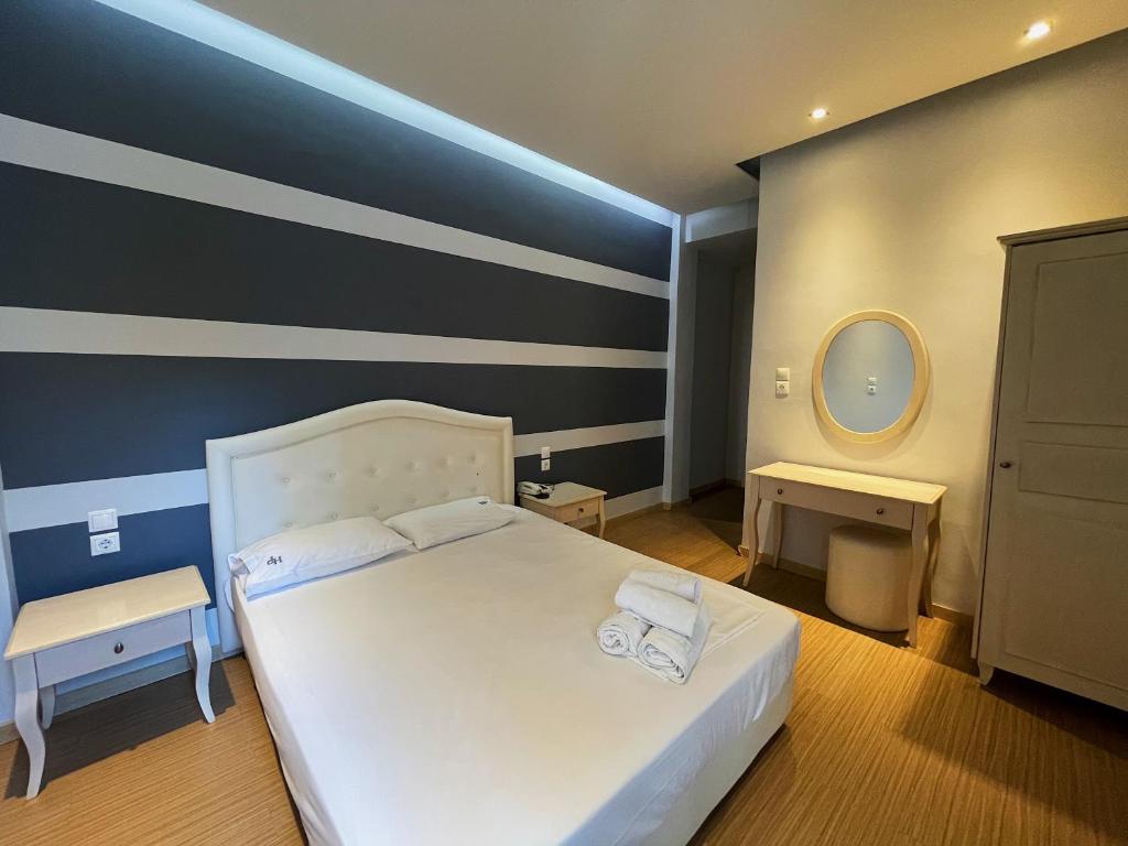 Postel nebo postele na pokoji v ubytování Platon Hotel