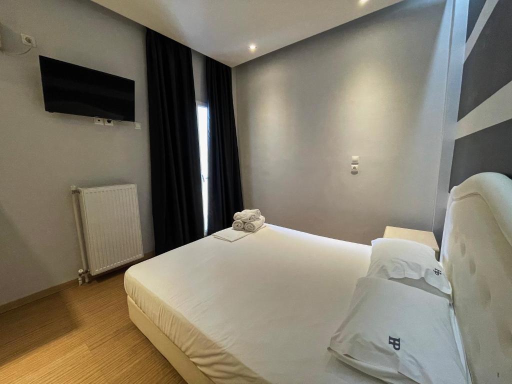 Postel nebo postele na pokoji v ubytování Platon Hotel