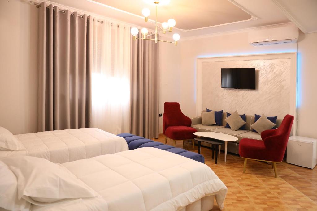 Postel nebo postele na pokoji v ubytování Hotel Vila Stefa