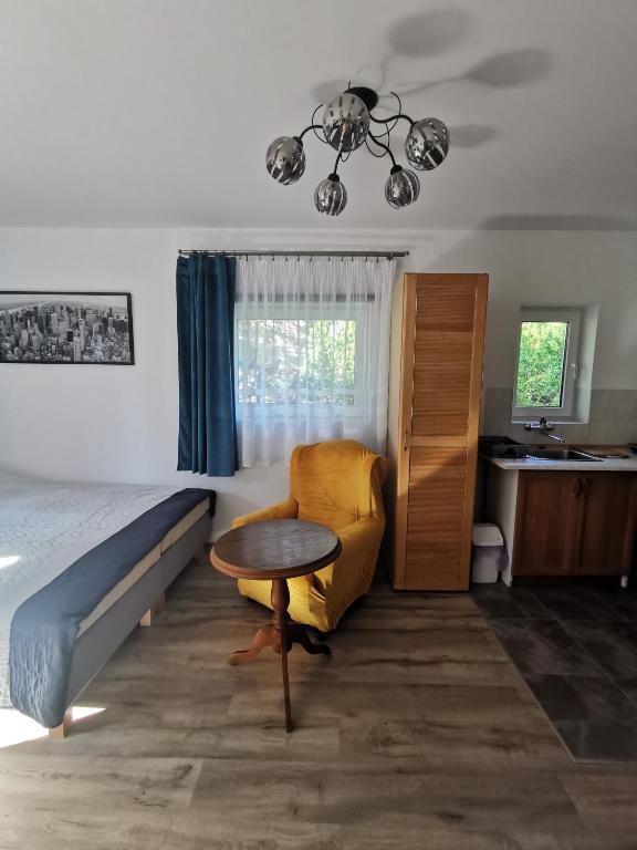 Posteľ alebo postele v izbe v ubytovaní Apartament Ogrodowa
