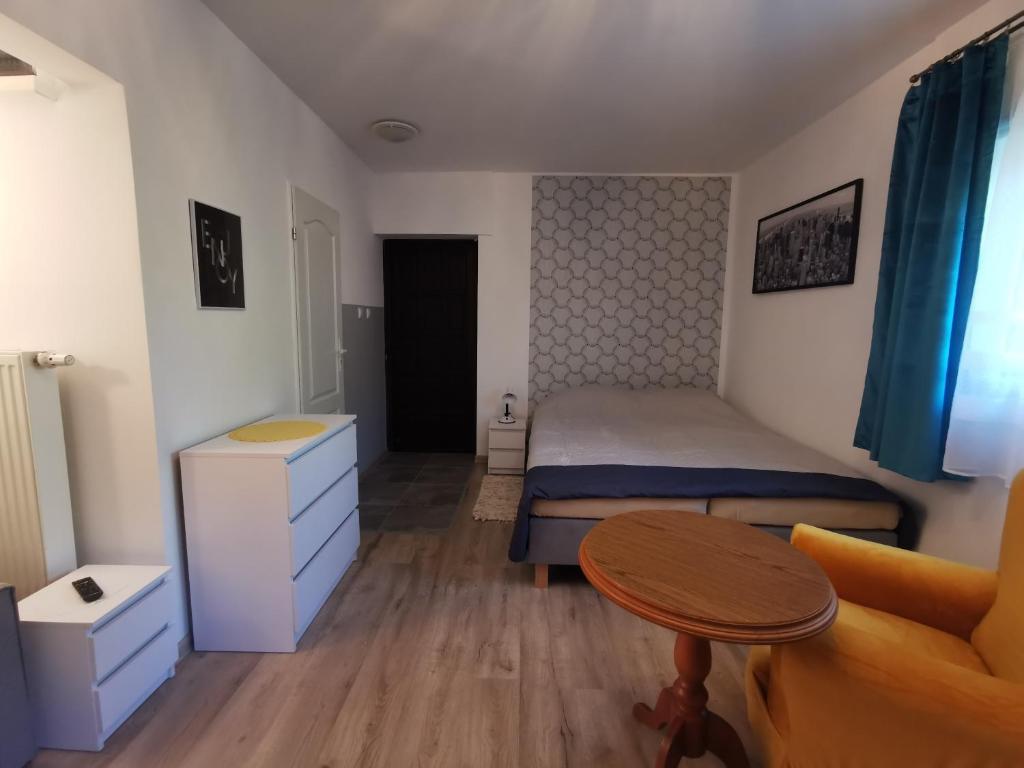 Posteľ alebo postele v izbe v ubytovaní Apartament Ogrodowa