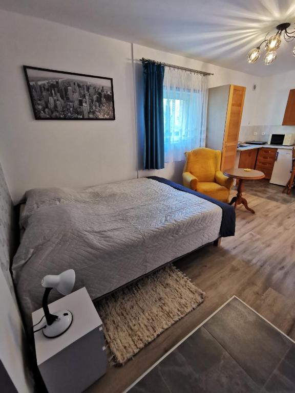 Posteľ alebo postele v izbe v ubytovaní Apartament Ogrodowa