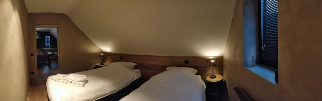 Postel nebo postele na pokoji v ubytování BARNEYS HOUSE