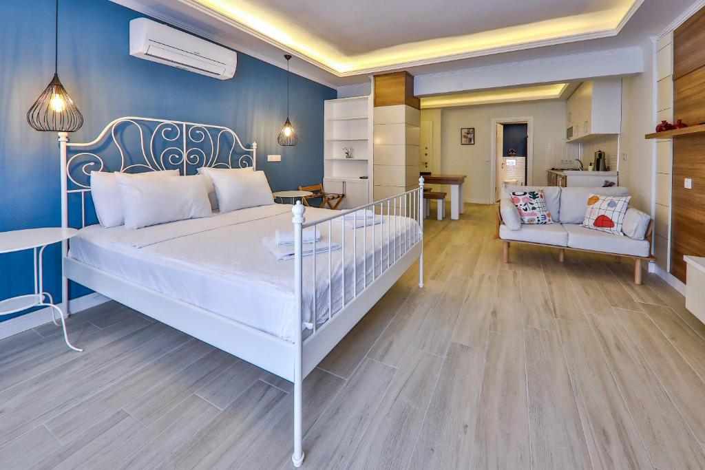 Postel nebo postele na pokoji v ubytování Yaz Apart Hotel