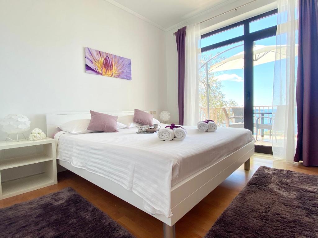 Posteľ alebo postele v izbe v ubytovaní Apartments La Perla