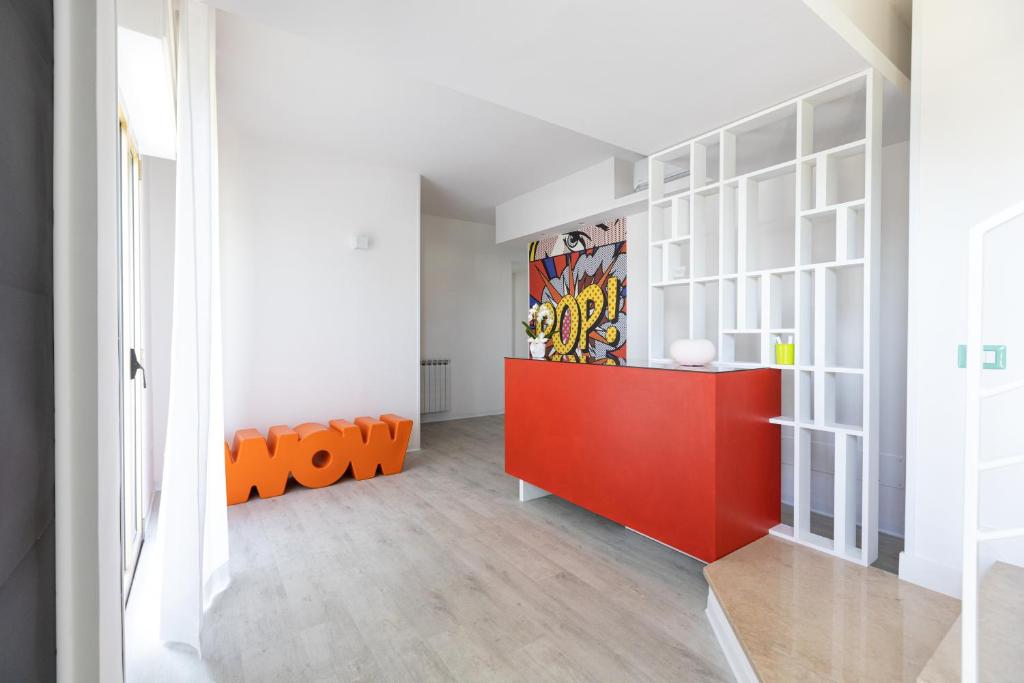 a room with a red cabinet and a red desk at Valmontone Travel Rooms in Valmontone