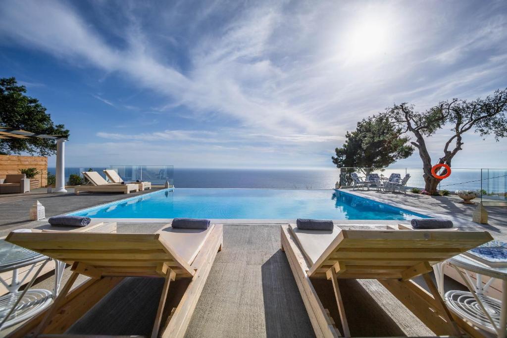 a swimming pool with a view of the ocean at Ocean View - Luxury Villa Nefeli in Corfu