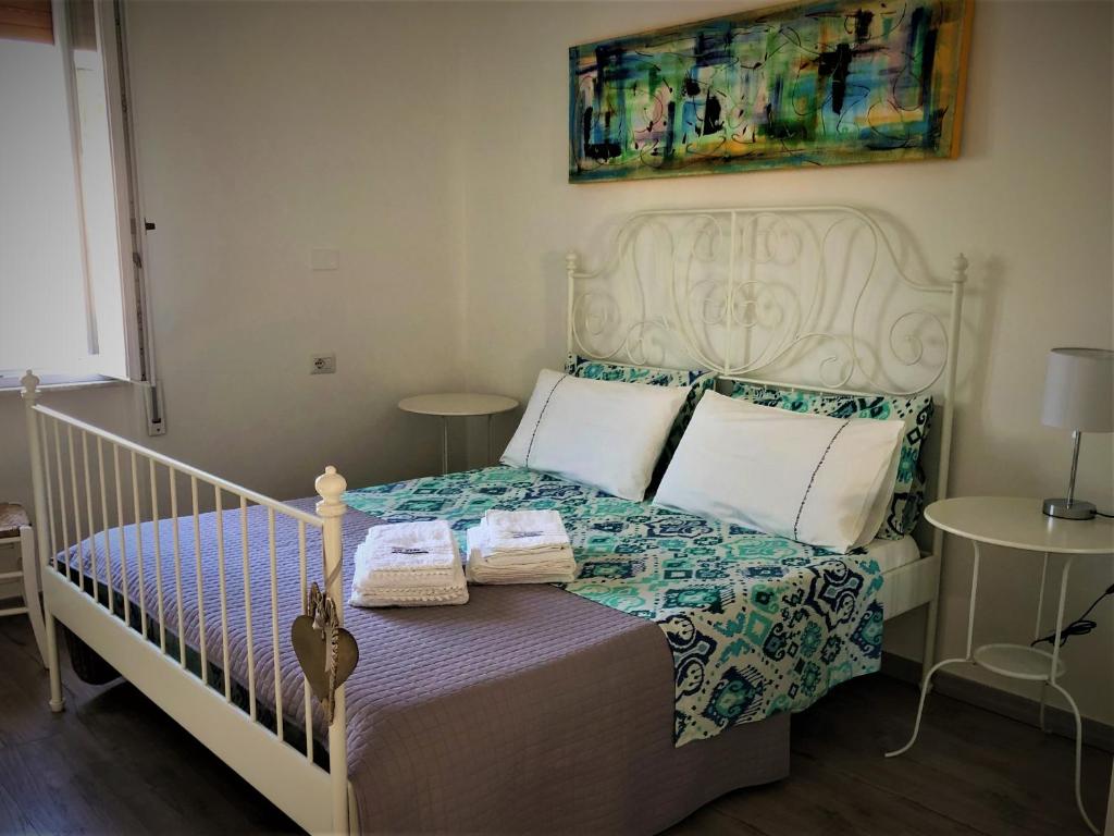 Postel nebo postele na pokoji v ubytování Il Faro di Alghero