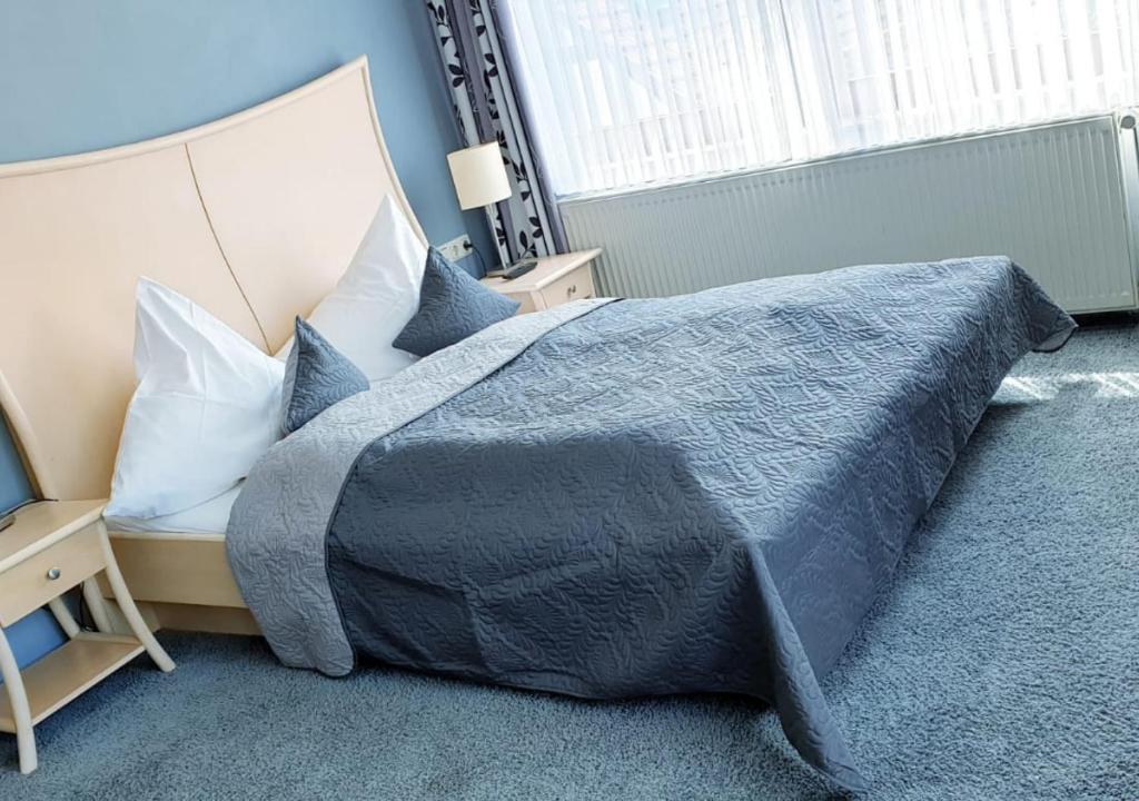Postel nebo postele na pokoji v ubytování Hotel Igelstadt