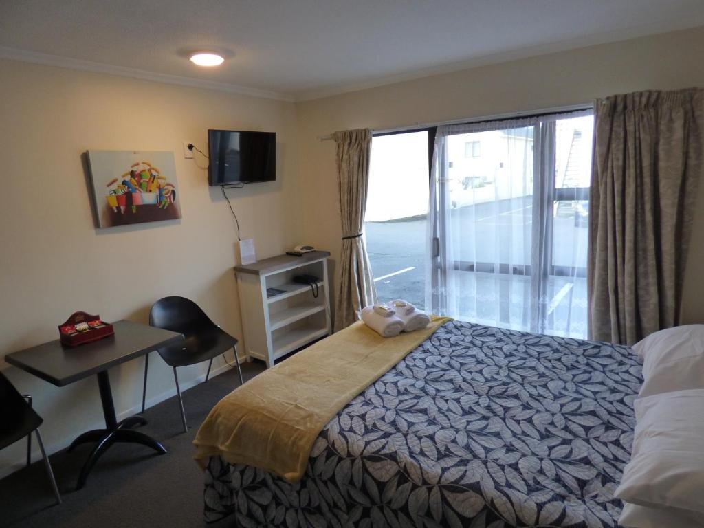 Postel nebo postele na pokoji v ubytování Sahara Motels