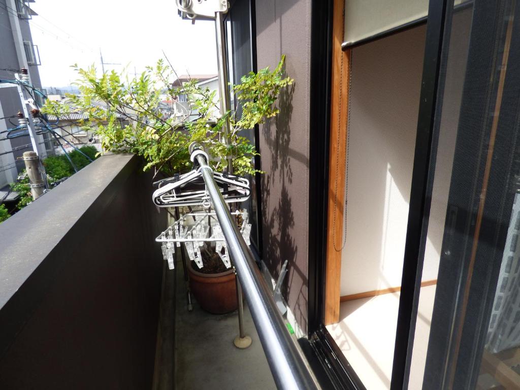 Balkón nebo terasa v ubytování Guesthouse Hyakumanben Cross