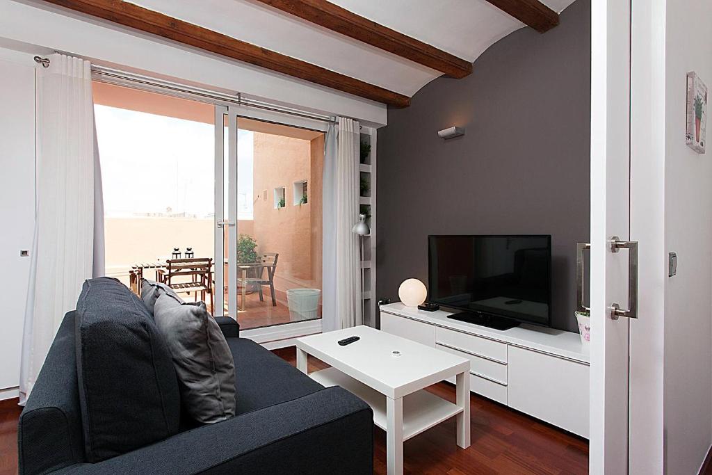 Televízia a/alebo spoločenská miestnosť v ubytovaní MUN41 · MUN41 - Sagrada Família private terrace apartment