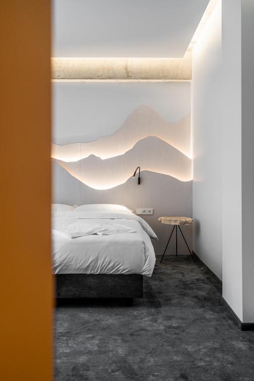 Postel nebo postele na pokoji v ubytování ESE HOTEL