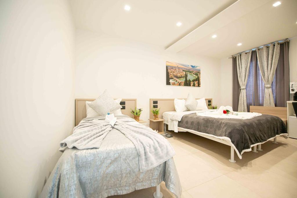 Postel nebo postele na pokoji v ubytování HOME CARPEDIEM