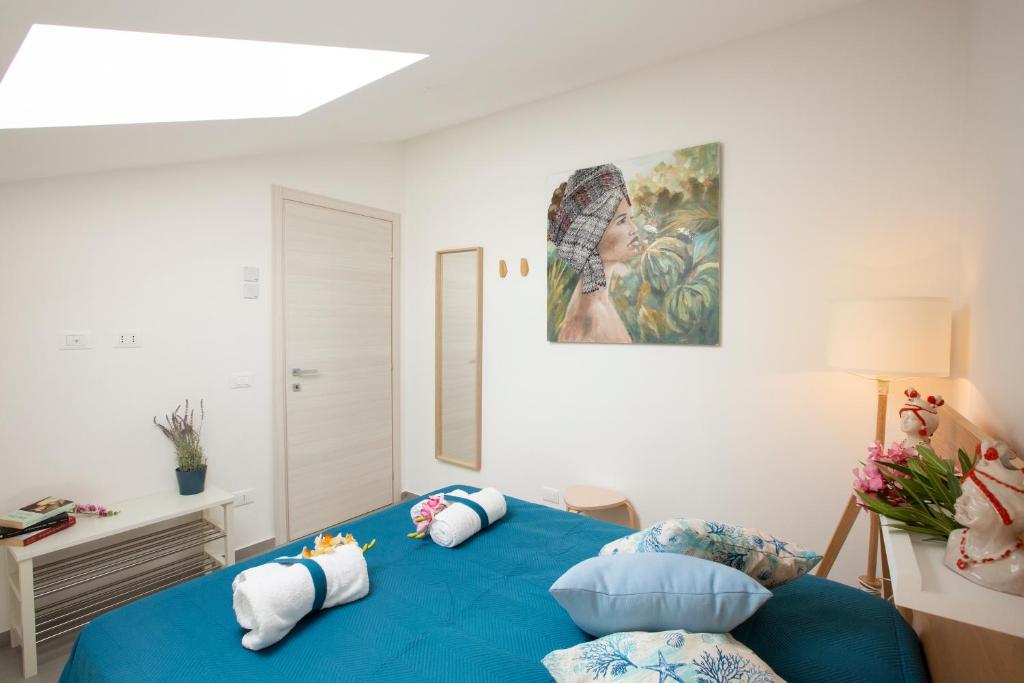 A bed or beds in a room at Splendida Villa NATURE- APPARTAMENTO ARANCIO a Scopello - Zingaro