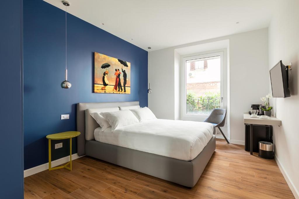 Кровать или кровати в номере Briseide Boutique Rooms Colosseum