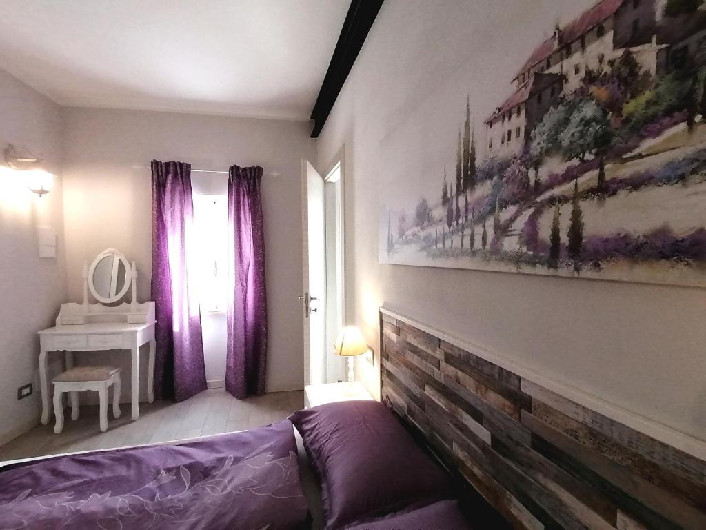A bed or beds in a room at Residenza al Castello