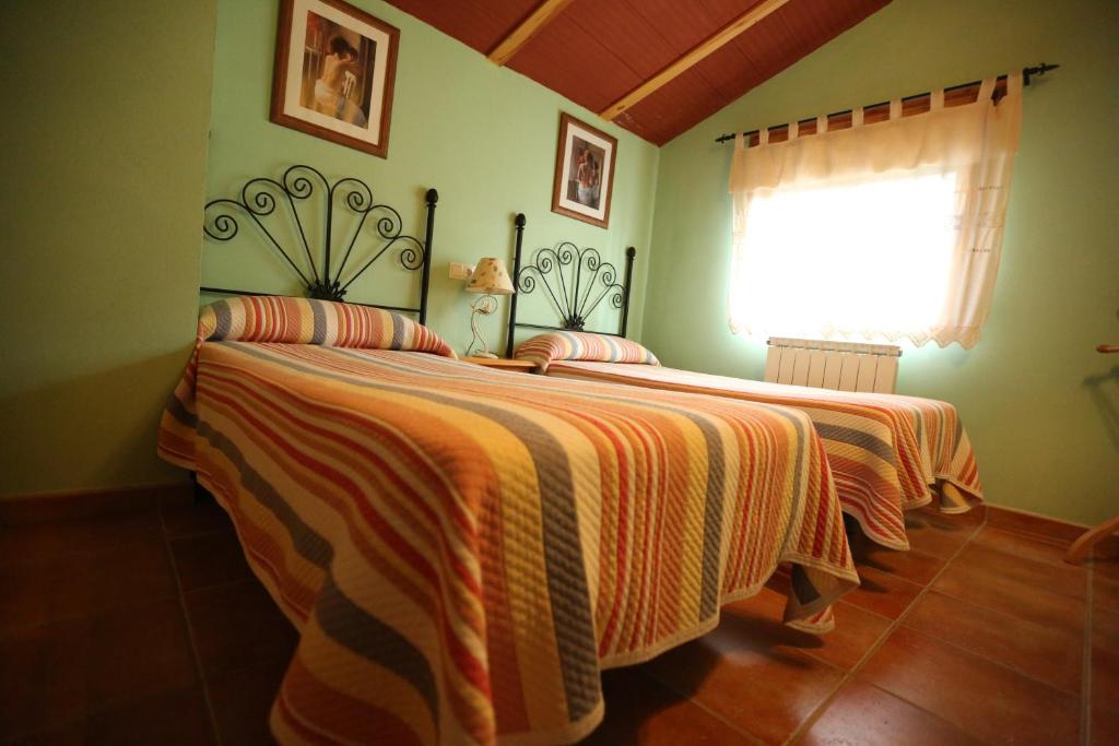 Postel nebo postele na pokoji v ubytování Casas Rurales El Cobijo de Sierra Cazorla