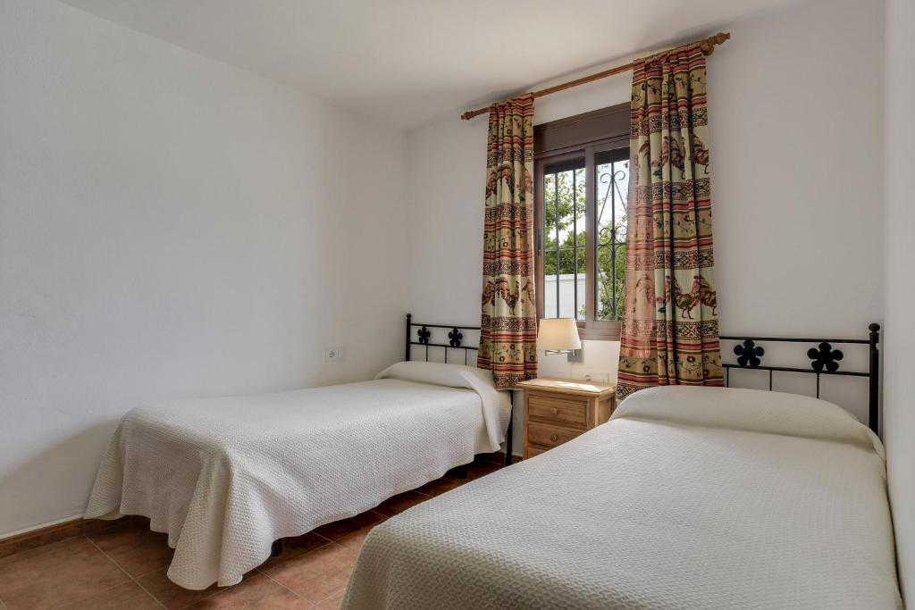 Postel nebo postele na pokoji v ubytování Casa Miguelin