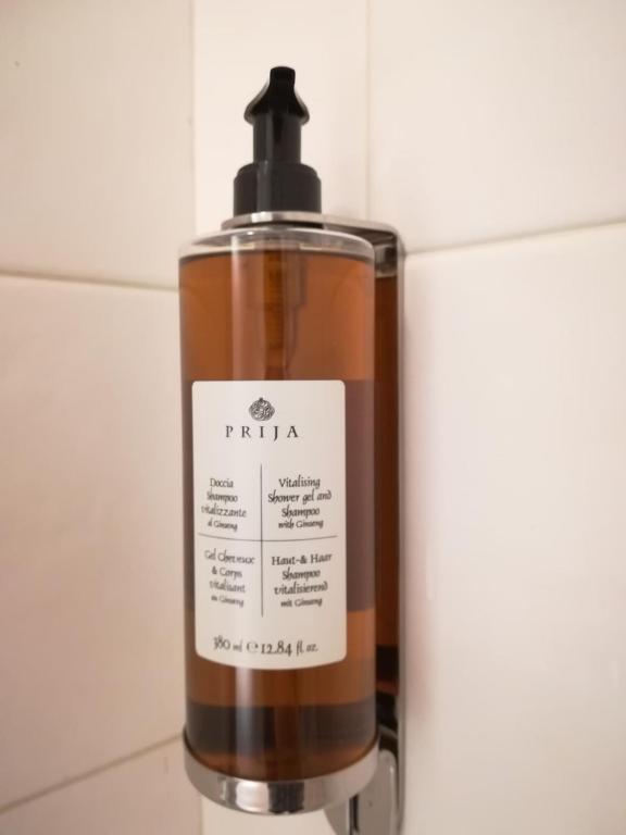 a bottle of soap sitting on top of a counter at Hotel Primavera in Peschiera del Garda