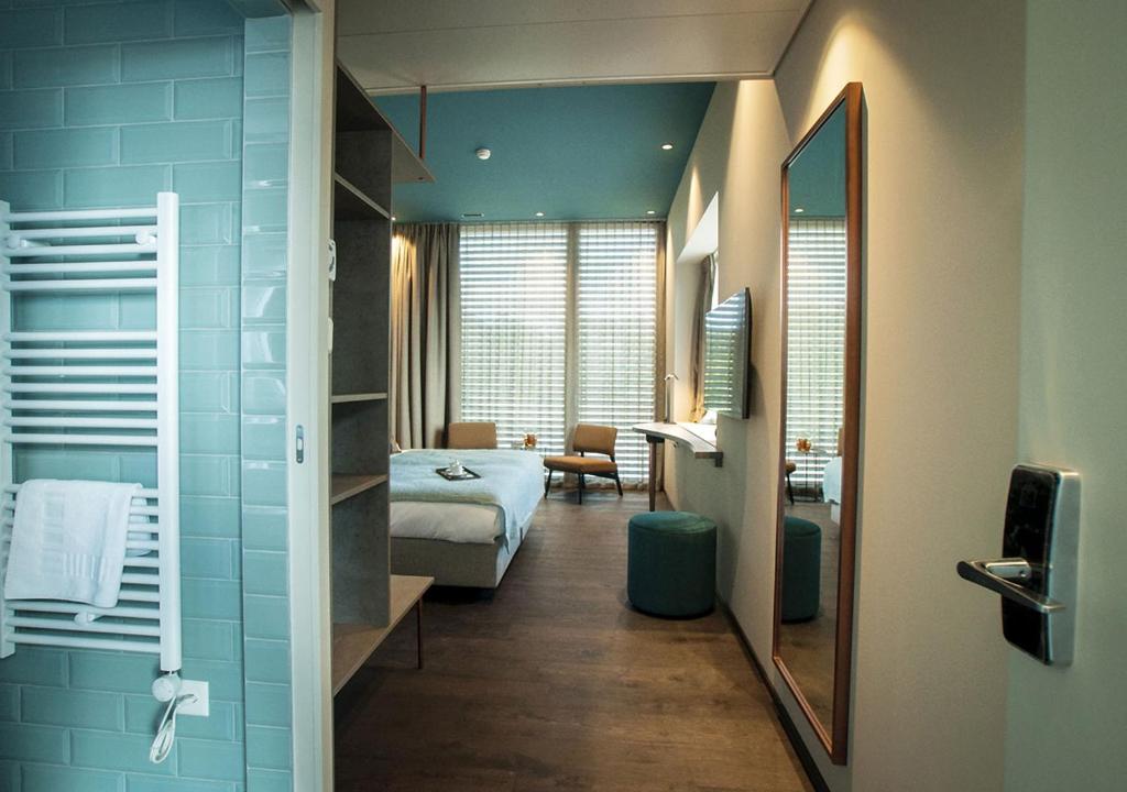 Postel nebo postele na pokoji v ubytování Hôtel Restaurant Port-Conty