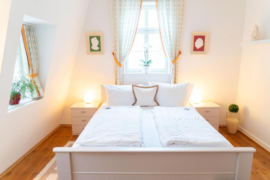 Postel nebo postele na pokoji v ubytování Appartementhaus am Schloss