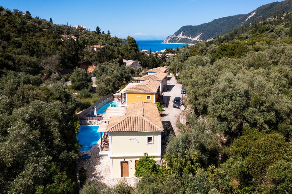 an aerial view of a villa with a swimming pool at Delphinus Villa Nefeli in Agios Nikitas