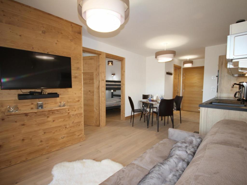 a living room with a couch and a table at Appartement Hauteluce, 3 pièces, 6 personnes - FR-1-293-268 in Hauteluce