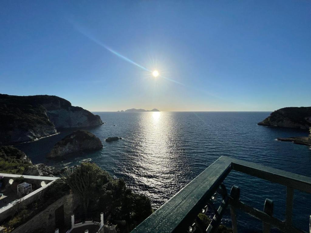 a view of the ocean from the balcony of a house at Magi - Il Tramonto su Palmarola in Ponza