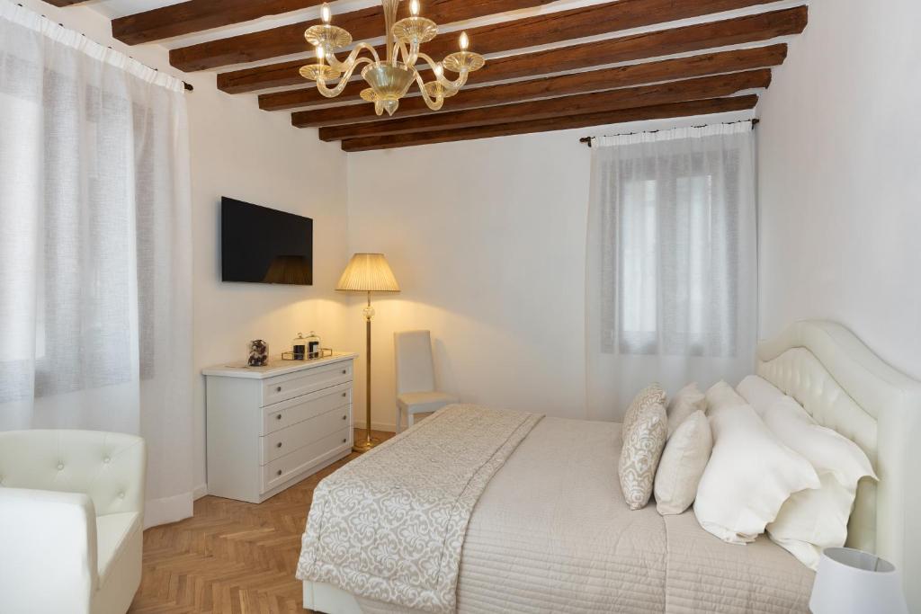 Posteľ alebo postele v izbe v ubytovaní Casanova Fenice - Canal View