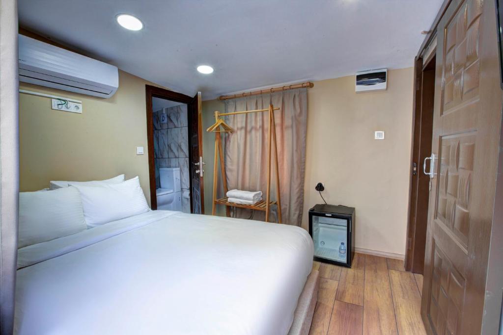 Postel nebo postele na pokoji v ubytování Maravilloso Hotel Pera