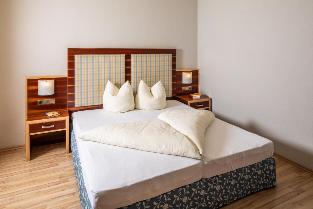 Postel nebo postele na pokoji v ubytování Apparthaus & Chalets Hofer