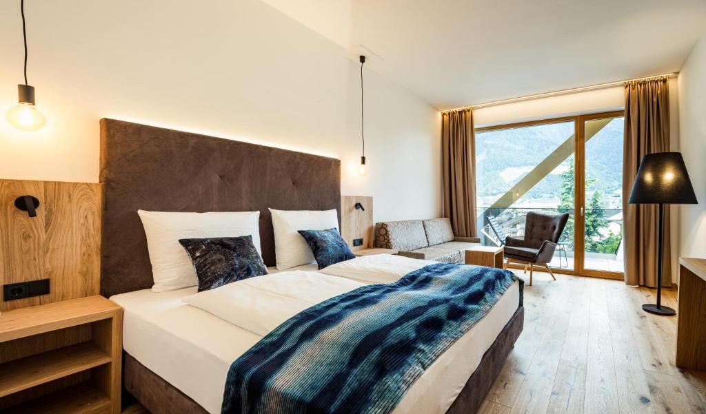 Postel nebo postele na pokoji v ubytování Genusshotel Diamant