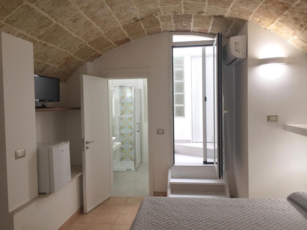 A bed or beds in a room at Ugento Dimora