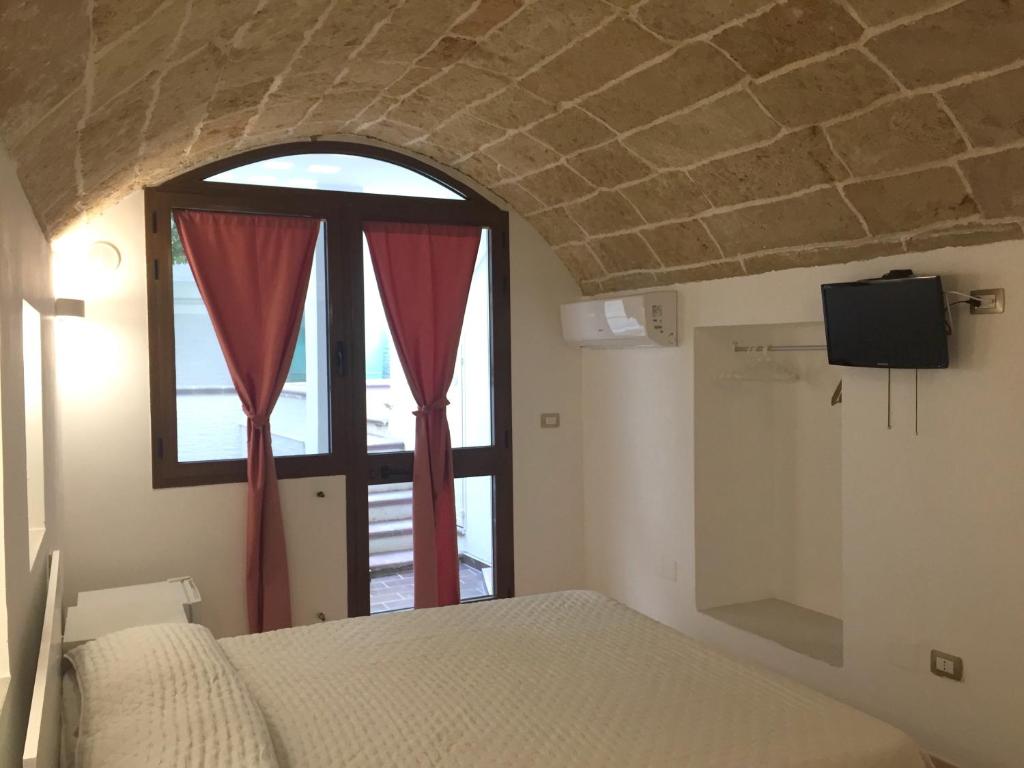 A bed or beds in a room at Ugento Dimora