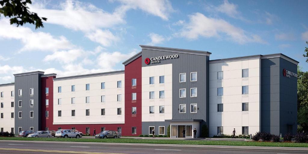 a large white building with a red and white at Candlewood Suites - Nashville South, an IHG Hotel in Nashville