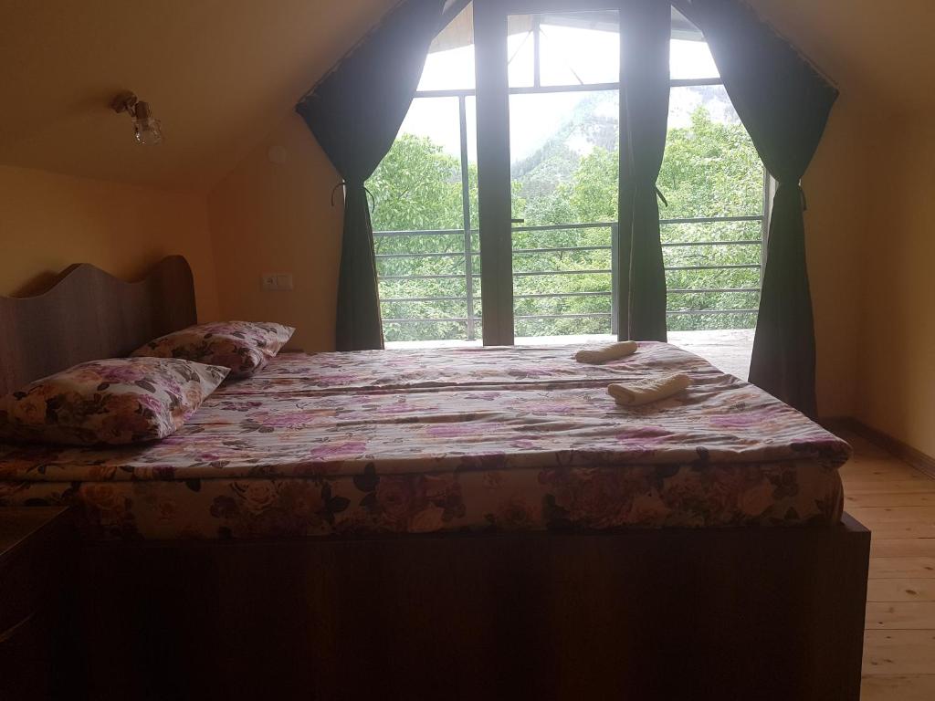 Llit o llits en una habitació de Guest House Sando