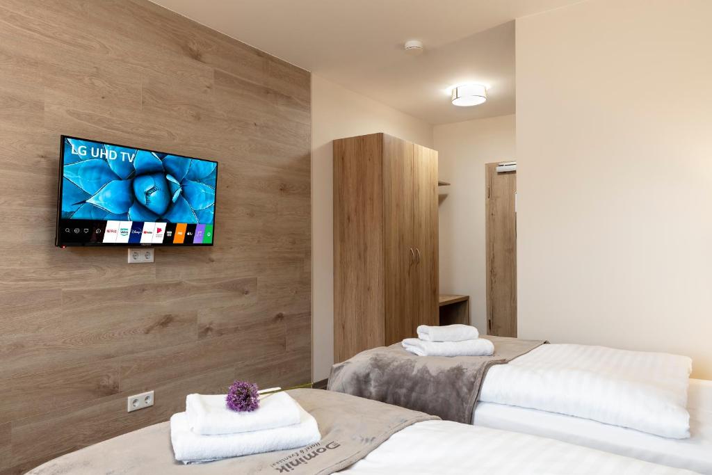 Postel nebo postele na pokoji v ubytování Dominik Hotel & Eventsaal
