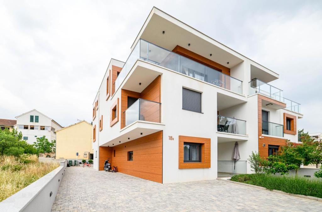a modern house with white and orange at Ledunis in Šibenik